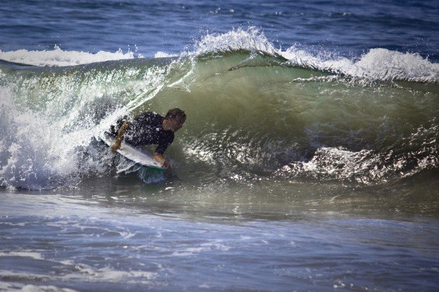 "Bodyboarding on big waves"