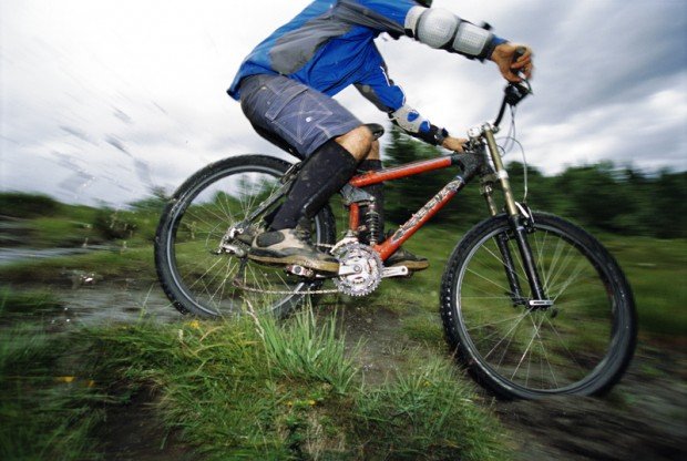 "Young man mountain biking"