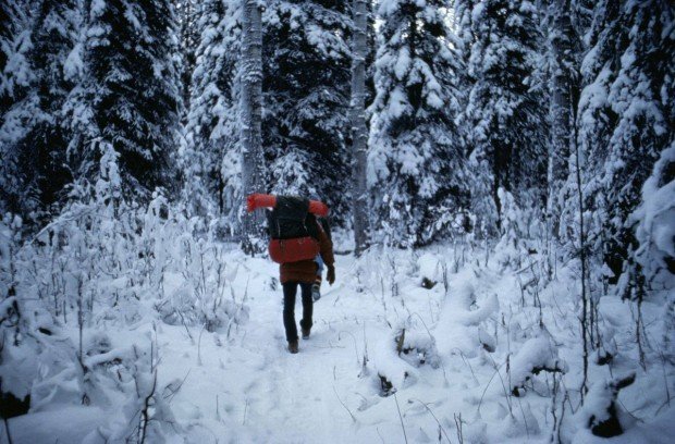 "Backpackers walking though the snow"