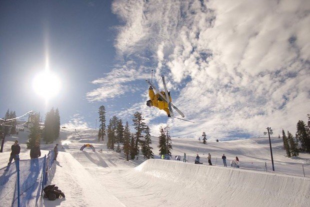 "Alpine Skier jumping over Boreal Mountain Terrain"
