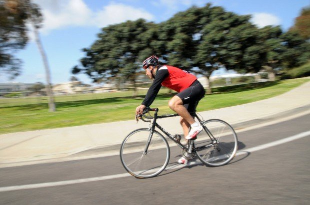 "Cyclist riding fast"