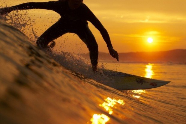 "Surfing at sunset"