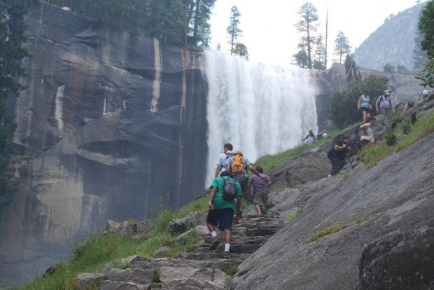 "Backpacking near magnificent water falls at Yosemite National Park"