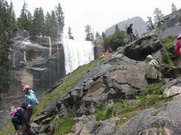 "Hikers admiring the magnificent view at Yosemite National Park"