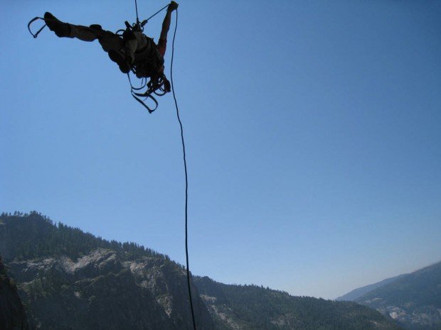"Swinging over a cliff at Yosemite National Park"
