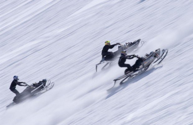 "snowmobiling in the mountains"