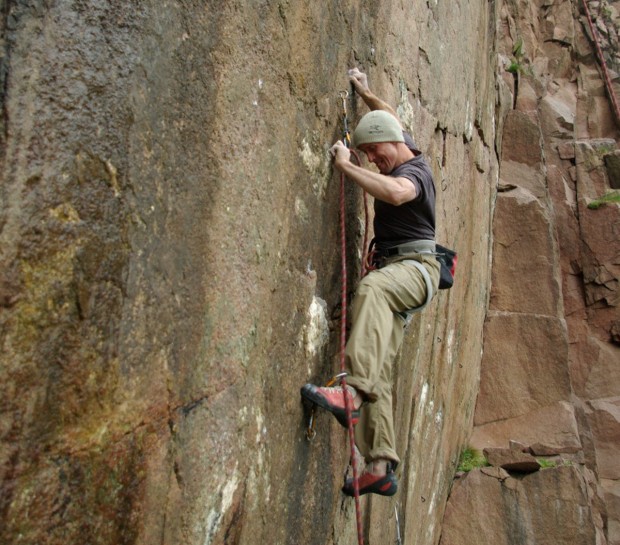 "Climbing on rocks at Longhaven"