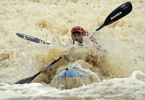 "Participants of Dusi Canoe Marathon negotiate rapids on the first day of competition in South Africa"