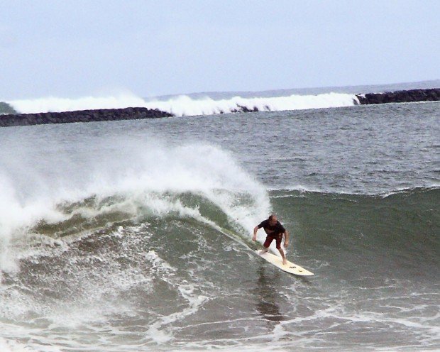 "Surfing at Hilo Breakwall"