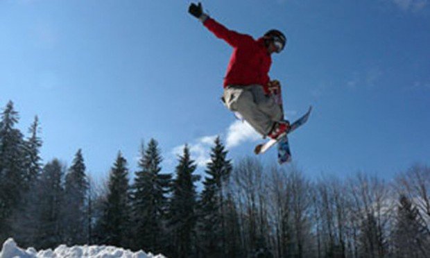 "Skiboarder jumps"