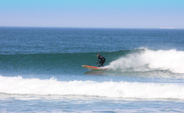 "Surfing at Outer Banks Beach"