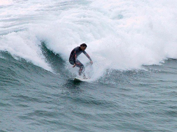 "Surfing at Sunset Beach"