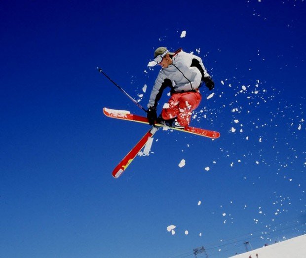 "Alpine Skier jumps"