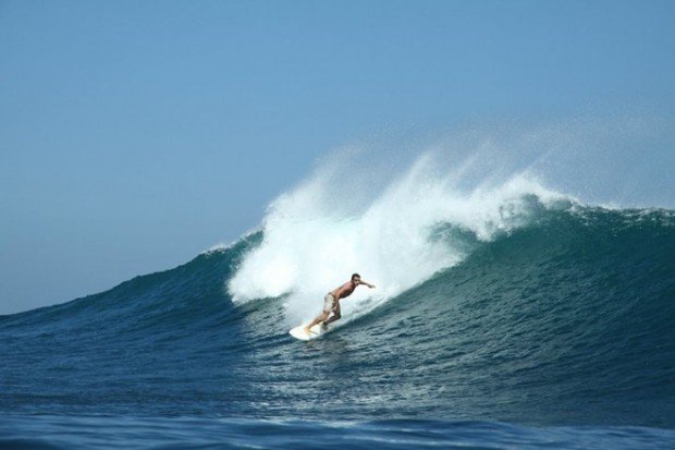 ''Surfing at Uluwatu Beach''