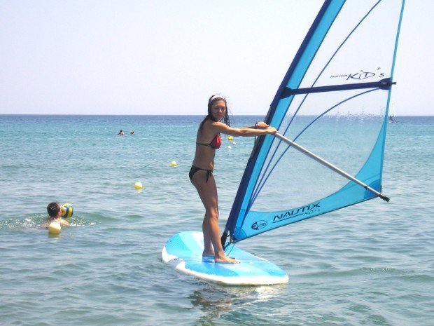 "Windsurfing at Schinia Beach"