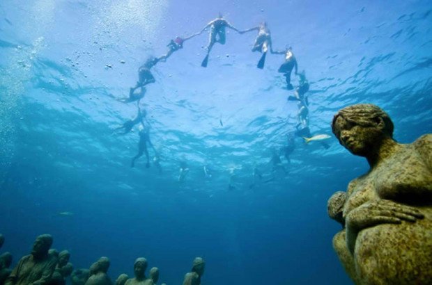 "Scuba Diving in the underwater sculpture museum of Cancun"