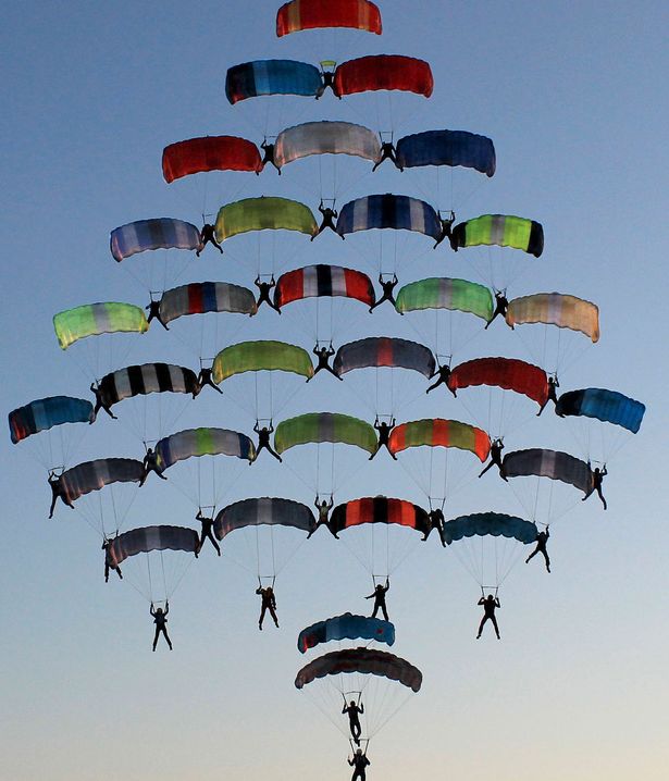 "Skydivers decorated the Christmas sky with a Christmas tree formation"