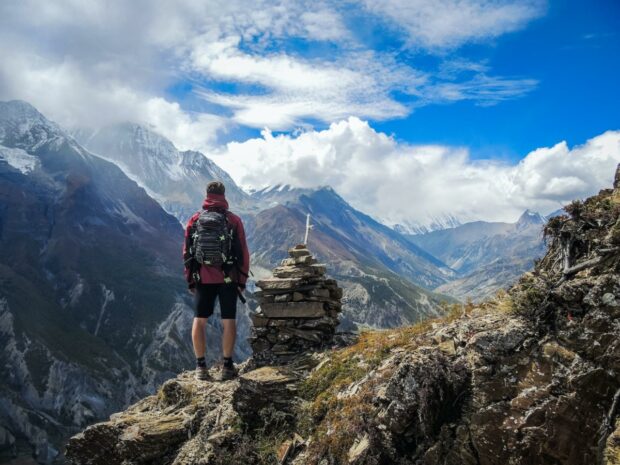 Image source: https://unsplash.com/photos/man-standing-on-top-of-mountain-beside-cairn-stones-48nerZQCHgo